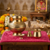 A Perfect Spiritual Gift of Purity and Tradition. Experience the divine essence of Haridwar with our Ganga Amrit Brass Puja Set. Elegantly curated in a premium pink velvet box, this handcrafted collection is designed for those who value tradition and luxury. Whether for your personal home mandir or as a thoughtful gift for loved ones, this set brings peace and sanctity to every ritual. What’s Inside the Box: Embossed Brass Gangajali (1000ml): A beautifully carved brass vessel to store the holy water of Ganga. Traditional Brass Lota: For offering prayers and performing sacred abhisheka. Artisanal Brass Bell: A handcrafted bell that produces a deep, soothing sound for your rituals. Elegant Brass Diya: A sturdy and classic oil lamp to brighten your spiritual space. Why Choose This Set? High-Quality Brass: Made from premium grade brass with a long-lasting golden shine. Luxury Packaging: Comes in a velvet-lined sturdy box, making it an ideal gift for weddings, housewarmings, and festivals. Artisan Crafted: Each piece features intricate floral engravings by traditional craftsmen.
