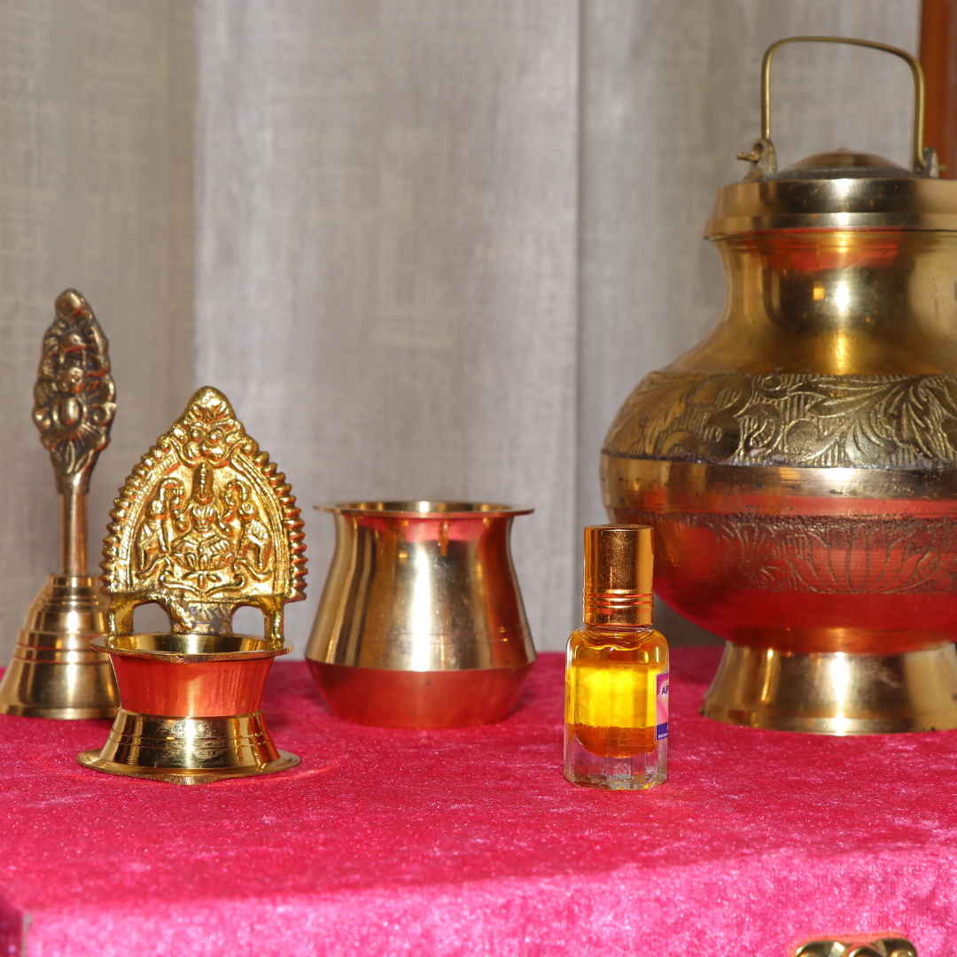 Elevate Your Daily Rituals with Pure Brass Elegance. The Divya Ganga Sacred Brass Puja Pack is a thoughtfully assembled collection for devotees who seek quality and tradition in their daily worship. This 5-piece set combines the strength of pure brass with the divine fragrance of Haridwar, making it a perfect addition to your home mandir or a meaningful gift for a loved one. What’s Inside the Pack: Embossed Brass Gangajali (1000ml): A large, beautifully crafted vessel to store holy Ganga water with a secure lid. Ornate Brass Deepak (Diya): A stunning oil lamp featuring an intricate backrest design to add a divine glow to your aarti. Traditional Brass Lota: A classic, polished vessel for offering jal (water) during rituals. Handcrafted Brass Ghanti: A resonant bell with an artistic handle to invoke peace and positivity. Pure Puja Ittra (10ml): A premium, alcohol-free fragrance bottle to create a serene temple-like atmosphere at home. Why Choose This Pack? Traditional Craftsmanship: Each brass item is handcrafted by skilled artisans to ensure a premium finish and long-lasting shine. Perfect Balance: Includes all the core essentials required for a complete puja vidhi. Divine Gifting: Packaged with care, it makes for an excellent gift for Housewarmings (Griha Pravesh), Festivals, and Anniversaries.