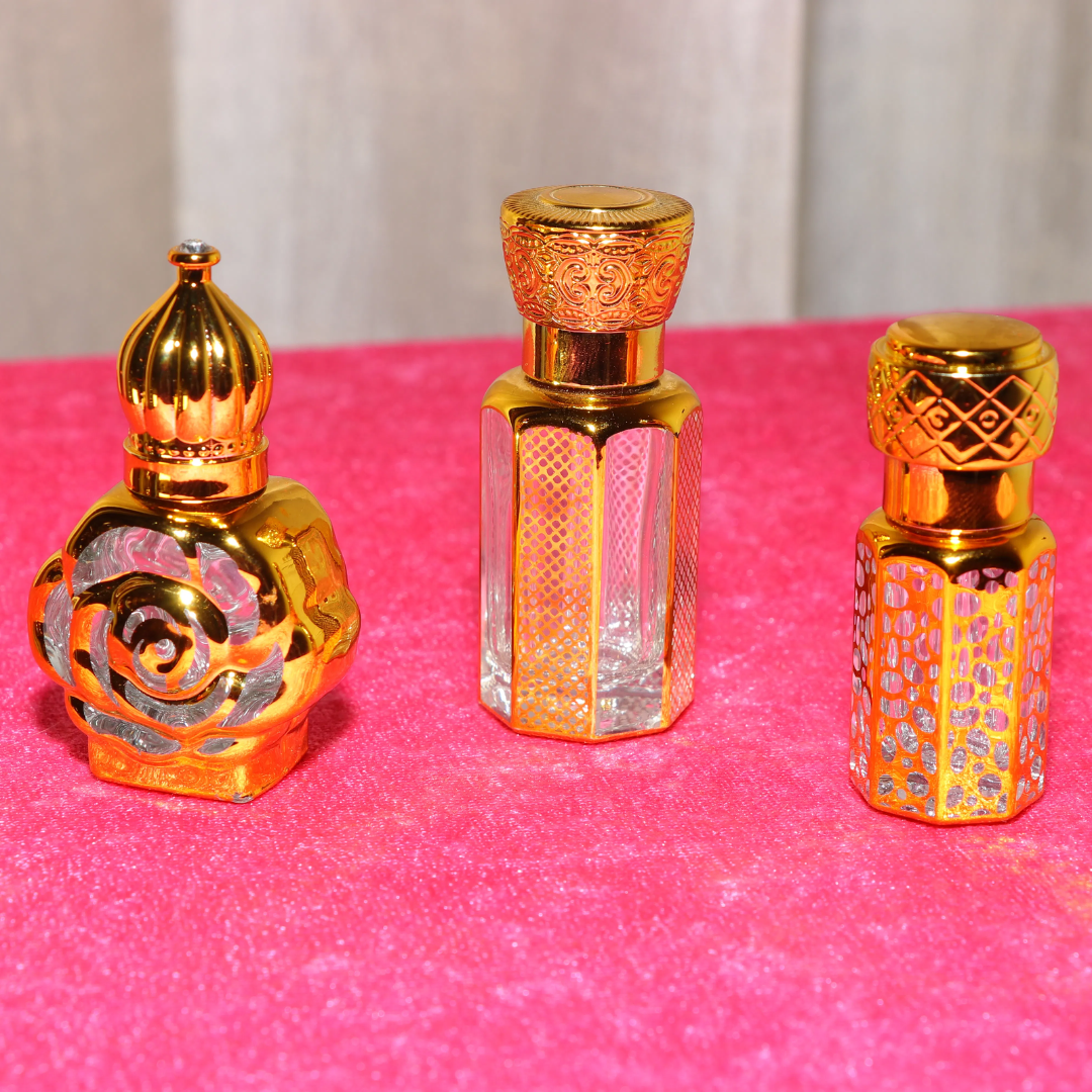 A Symphony of Sacred Scents in Every Drop. Elevate your spiritual journey with The Grand Attar Trio. This massive 60ml collection brings together three exquisite 20ml bottles of our finest concentrated perfume oils. Sourced from the purest ingredients, each bottle is a treasure trove of long-lasting fragrance that calms the mind and purifies the soul. Why the Grand Trio is a Must-Have: Generous Volume: Unlike standard small vials, this combo offers three 20ml bottles, ensuring your favorite divine scents last for months. 100% Alcohol-Free: Pure, skin-friendly Attar oil that is suitable for all religious rituals, meditation, and daily wear. Ornate Golden Artistry: The fragrances are housed in beautifully designed golden-filigree bottles that add a touch of royal elegance to your puja shelf or dressing table. Deeply Calming: Carefully curated scents inspired by the serene environment of Haridwar’s banks. Product Specifications: Total Volume: 60ml (Pack of 3 x 20ml Bottles) Type: Concentrated Perfume Oil (Attar) Longevity: Ultra long-lasting (6-12 hours per application) Perfect For: Gifting, Daily Puja, Meditation, and Special Occasions.